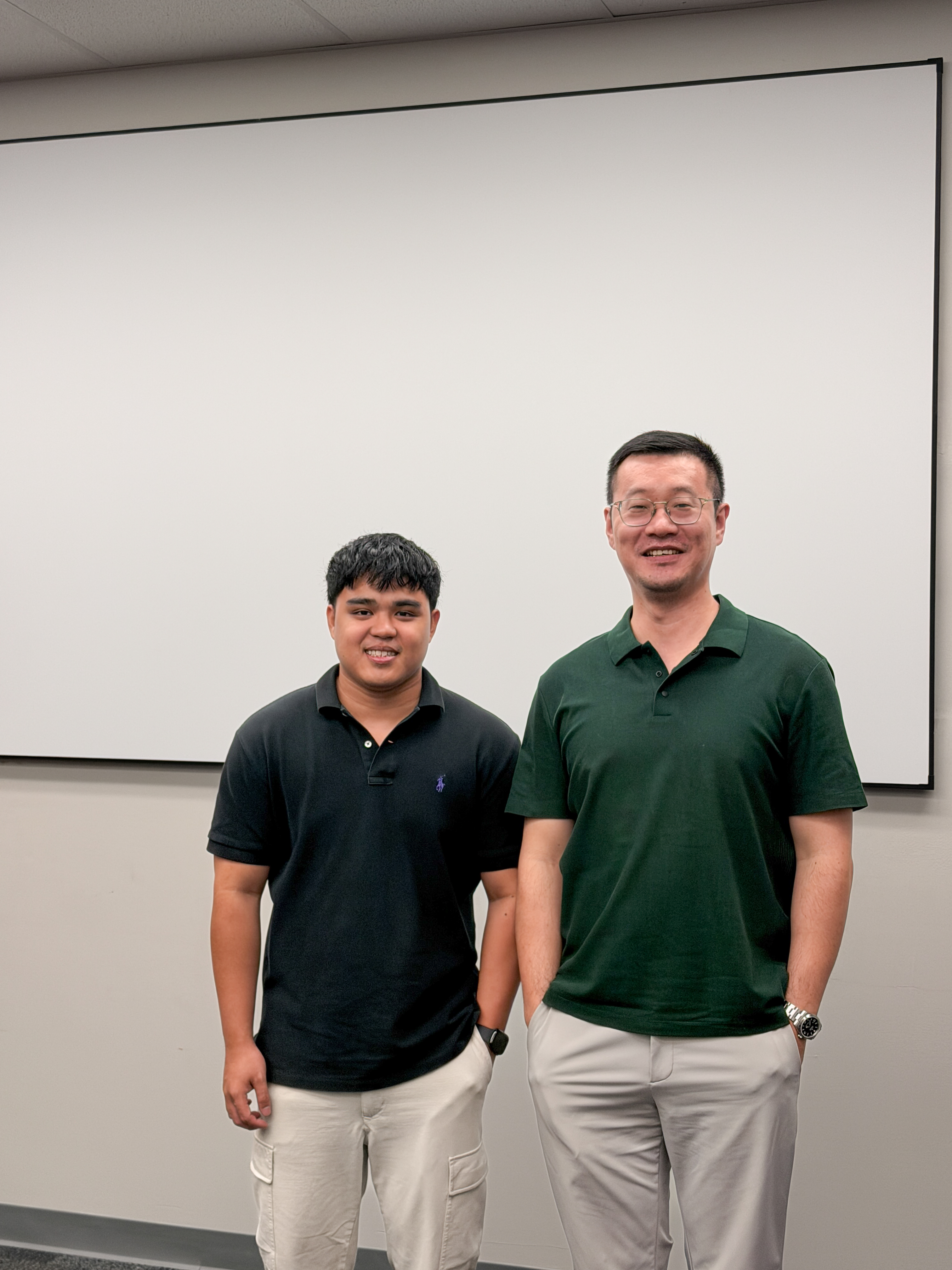 Angelo De Castro with his advisor Dr. Haipeng Yu after passing his PhD qualifying exam
