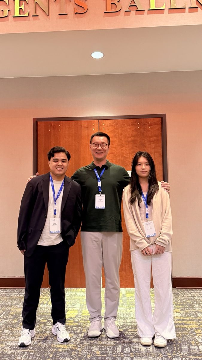 Angelo De Castro with Dr. Haipeng Yu and Jin at USPLF 2025
