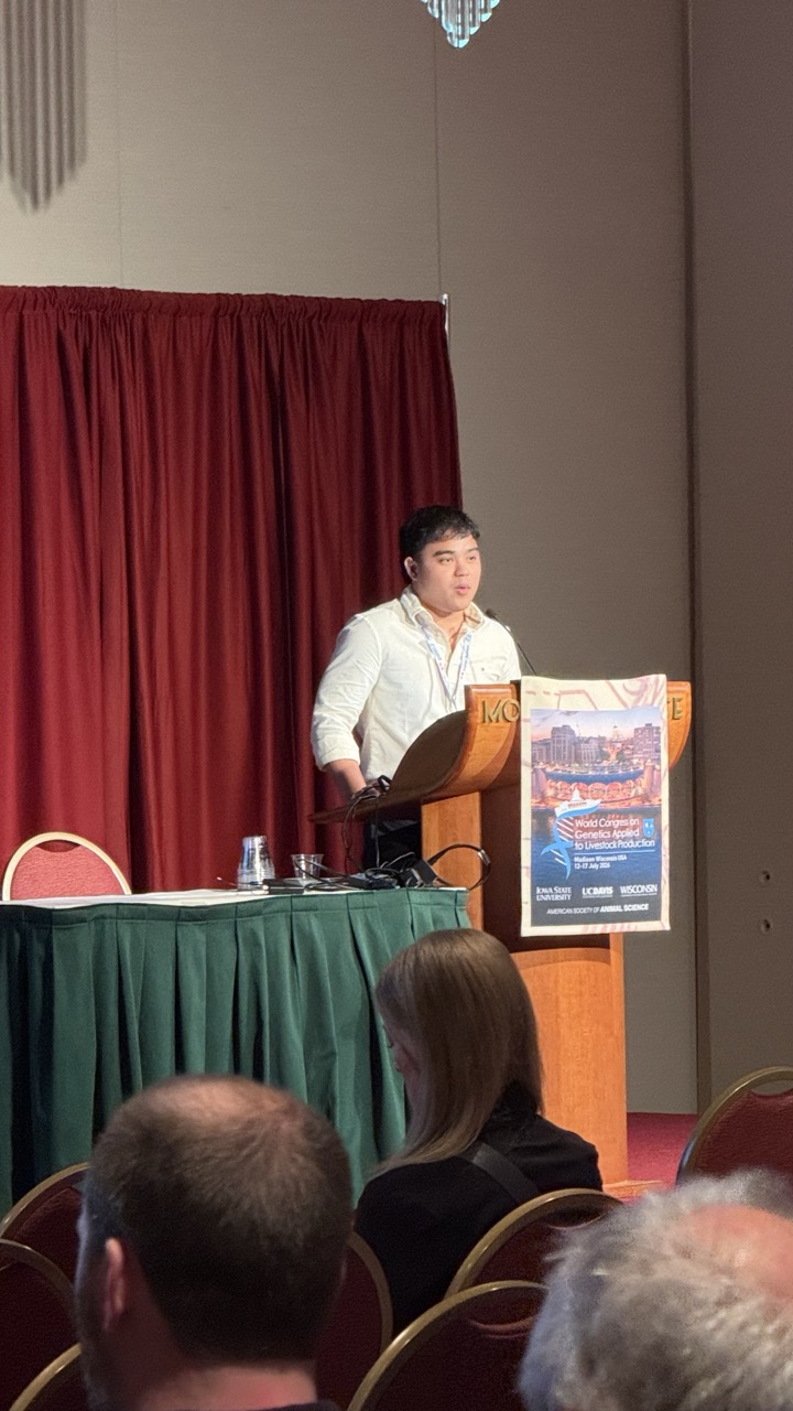 Angelo De Castro speaking at the podium at WCGALP